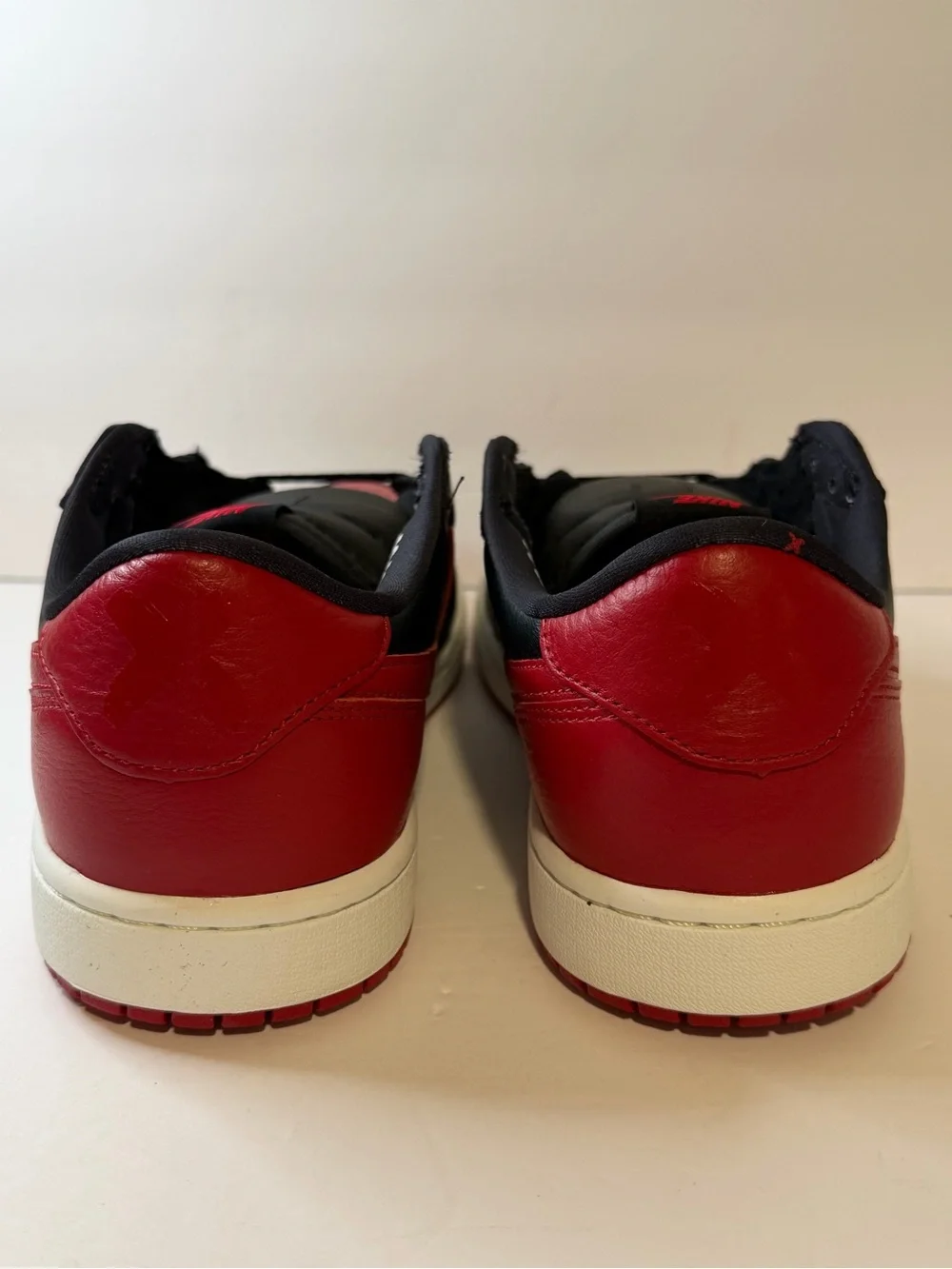 Jordan Low Top Sneaker in Black and Red
